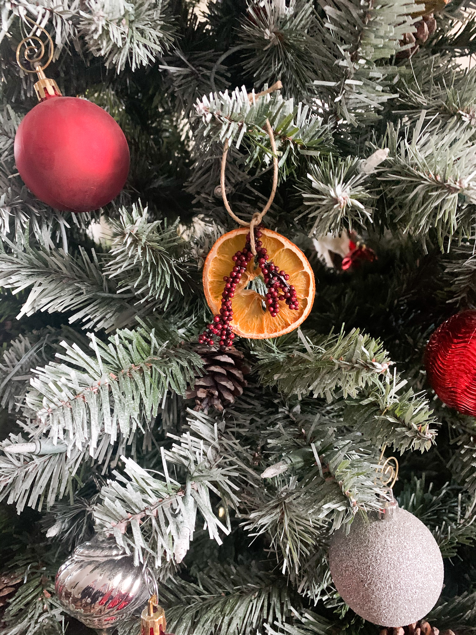 christmas tree with ornaments and dried orange ornament 