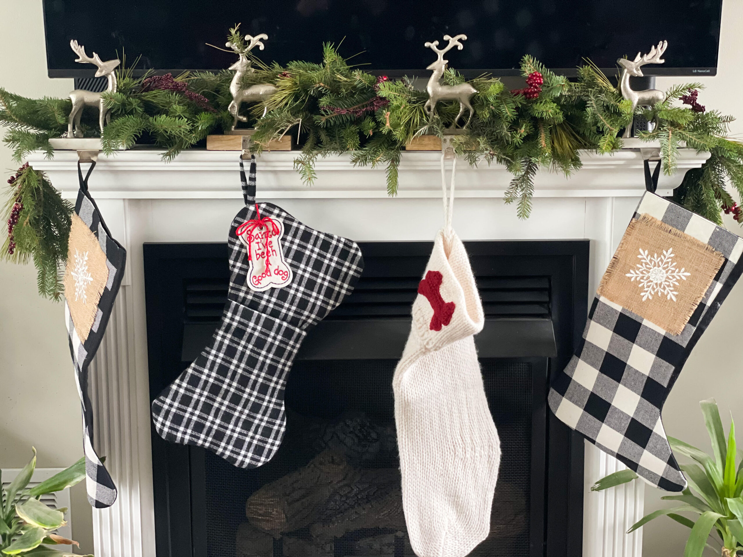 real pine garland on the mantle with stocking hanging 