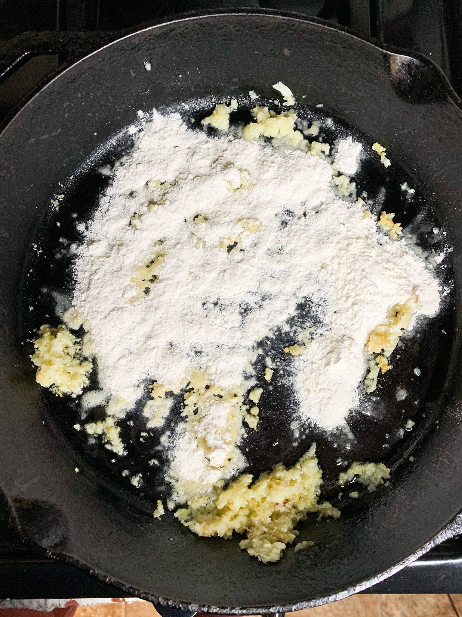 flour in butter and minced garlic