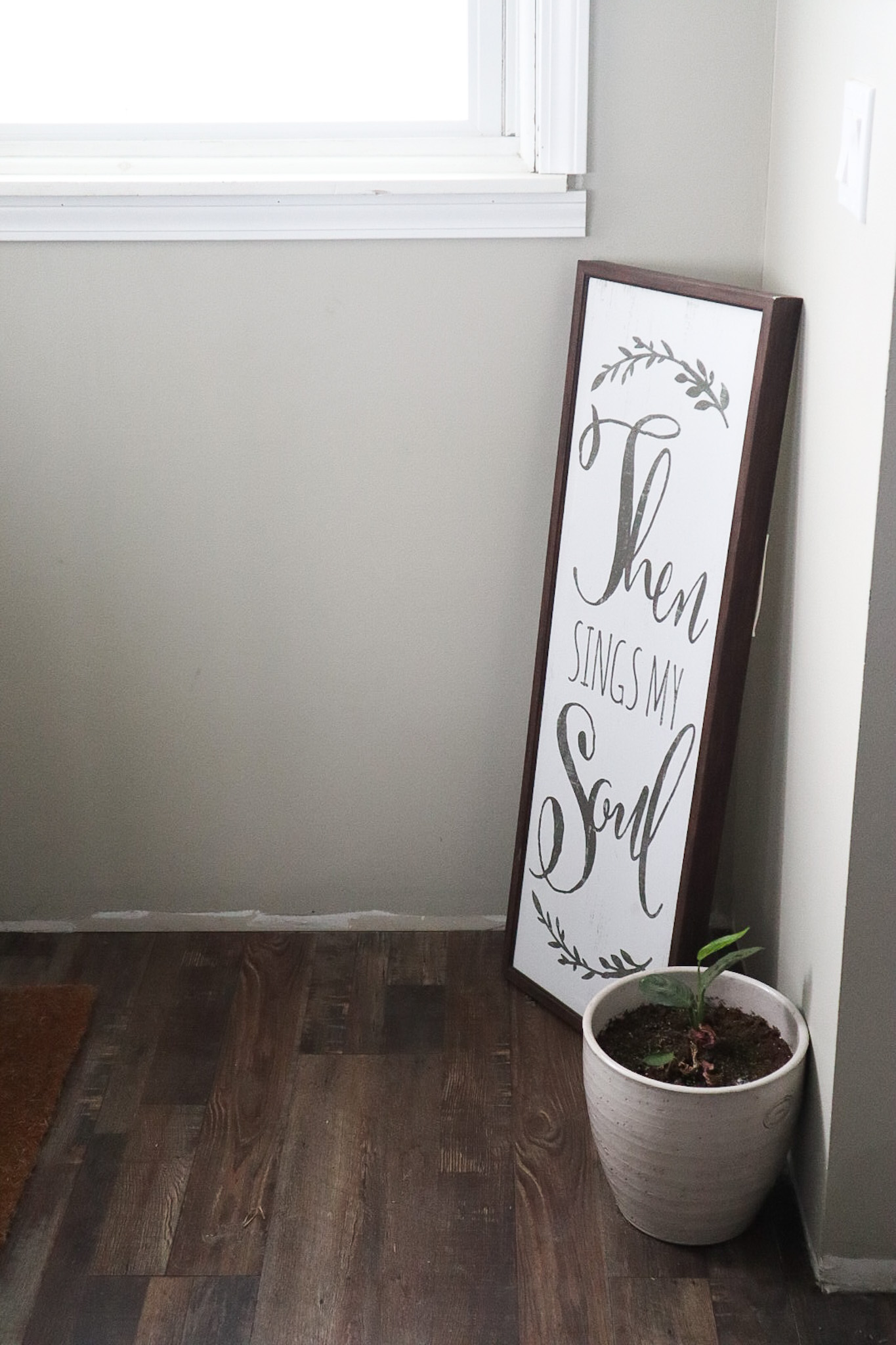 Sign in the corner of the wall that brings the feeling to the home when you walk in. 