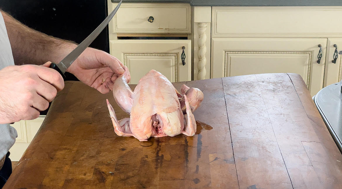 butchering chicken on a butcher block